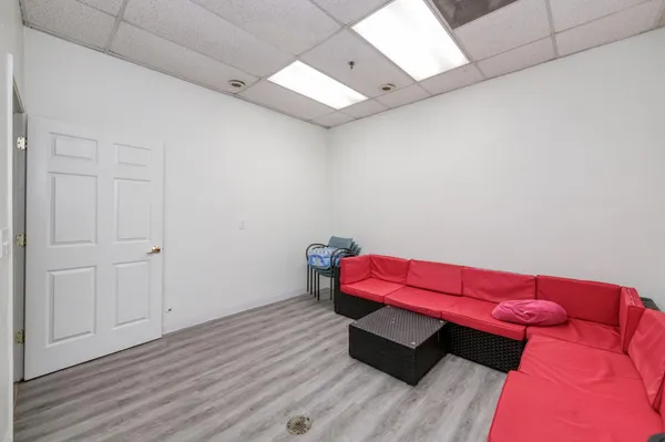 a room with furniture and wooden floor