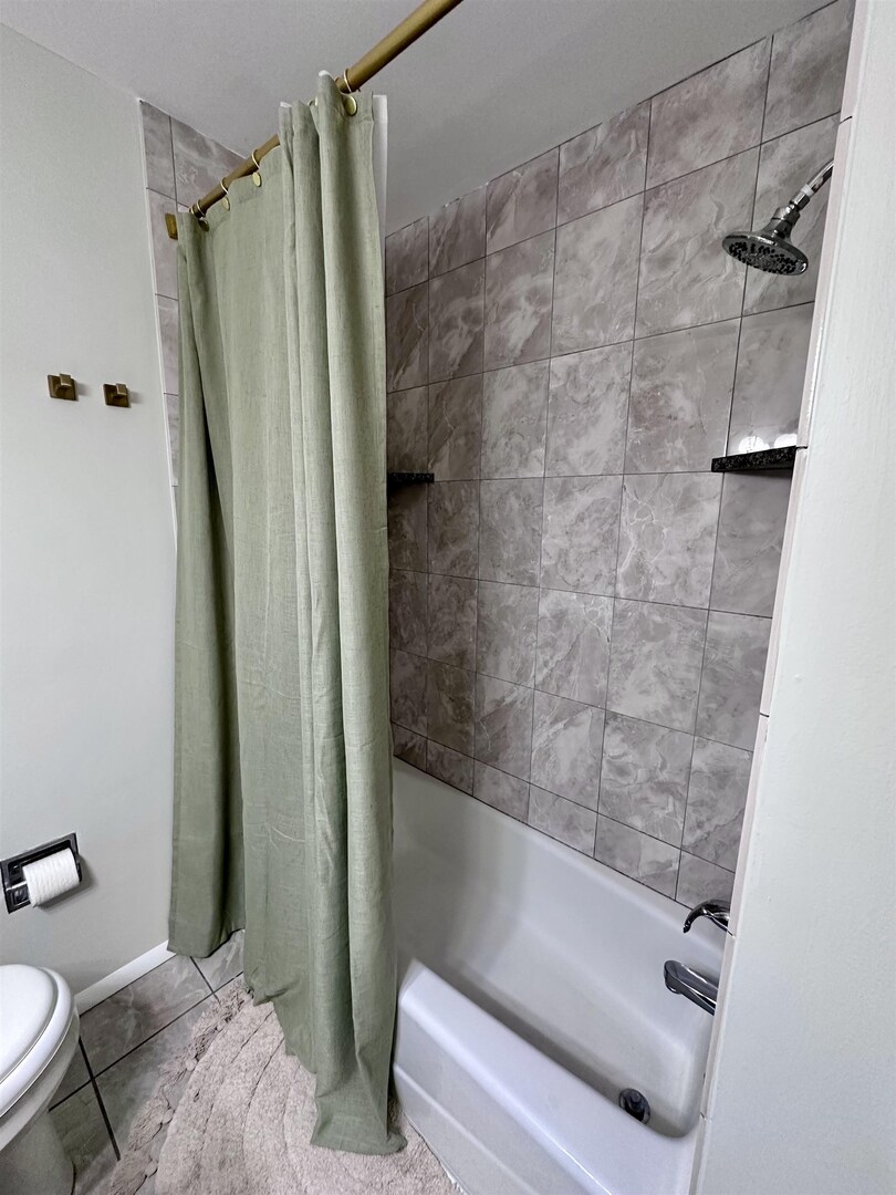 1830 28th Street Rock Island, IL 61201 - Photo 11 of 23 a bathroom with a shower and a toilet