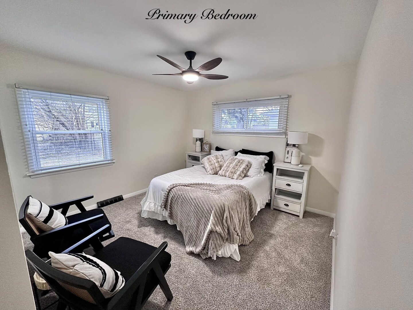 1830 28th Street Rock Island, IL 61201 - Photo 12 of 23 a bedroom with a bed and a chandelier