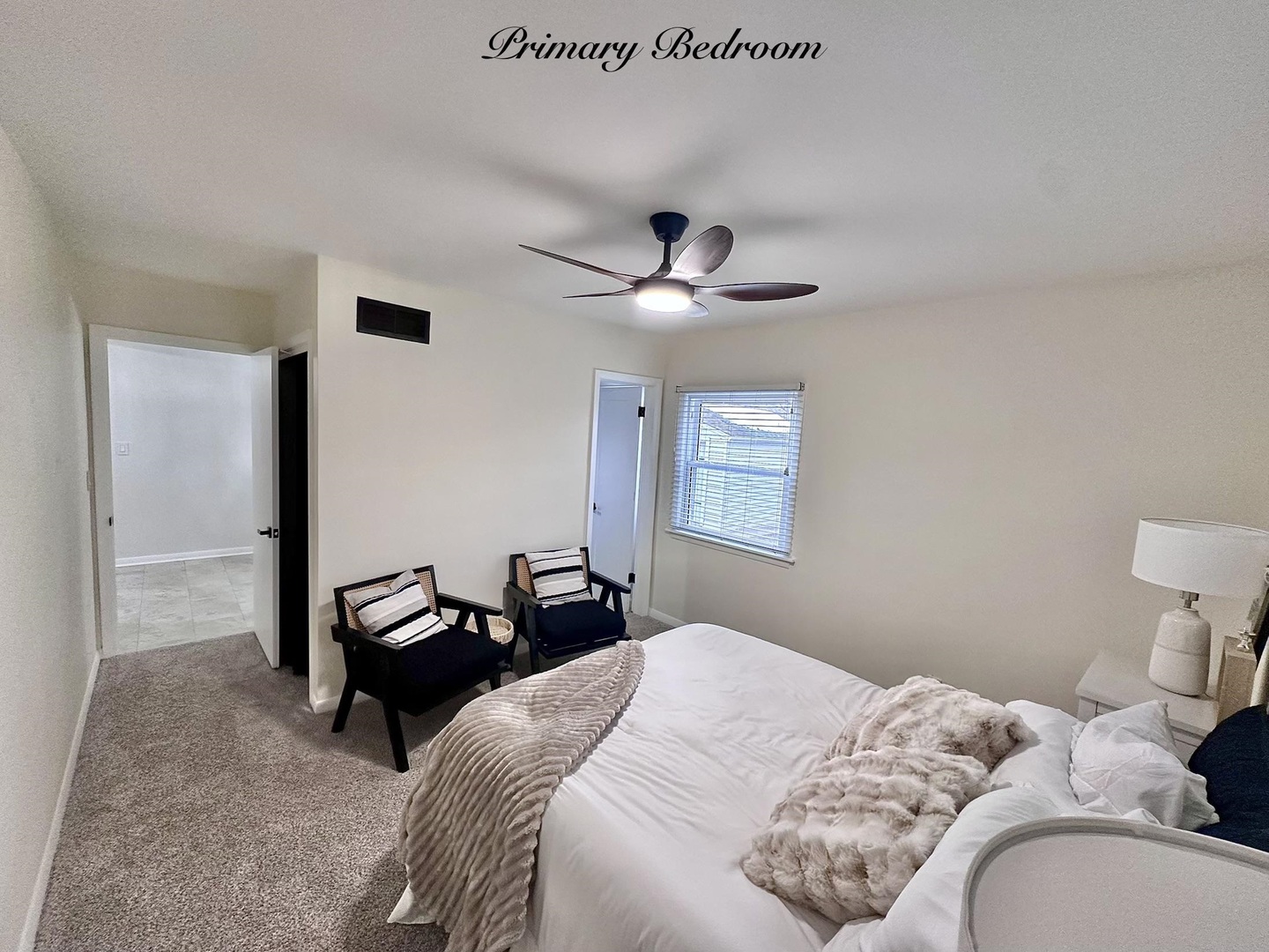 1830 28th Street Rock Island, IL 61201 - Photo 13 of 23 a bedroom with a bed and a chandelier