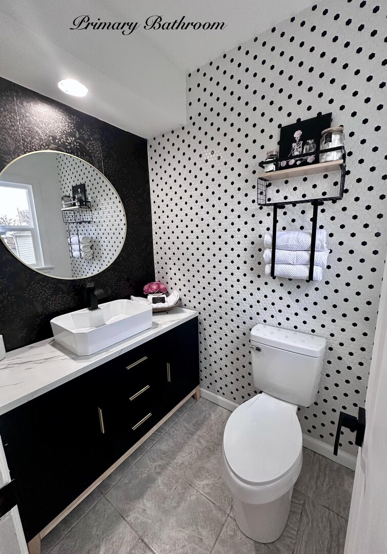 1830 28th Street Rock Island, IL 61201 - Photo 14 of 23 a bathroom with a sink toilet and mirror