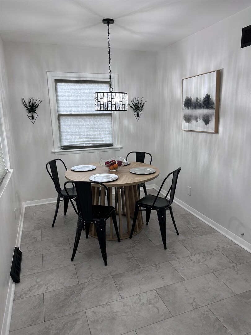 1830 28th Street Rock Island, IL 61201 - Photo 16 of 23 a view of a dining room with furniture