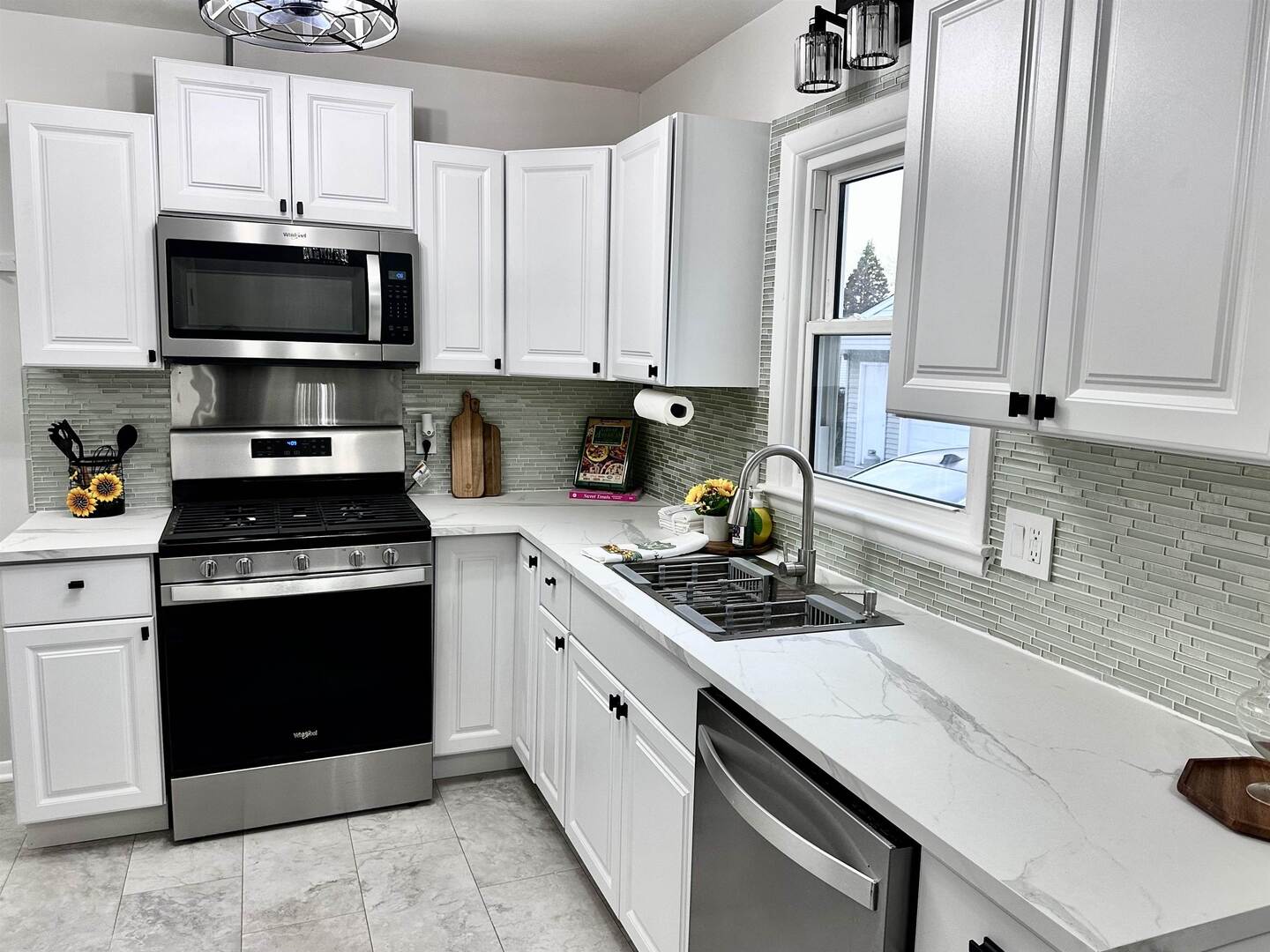 1830 28th Street Rock Island, IL 61201 - Photo 6 of 23 a kitchen with cabinets stainless steel appliances and a sink