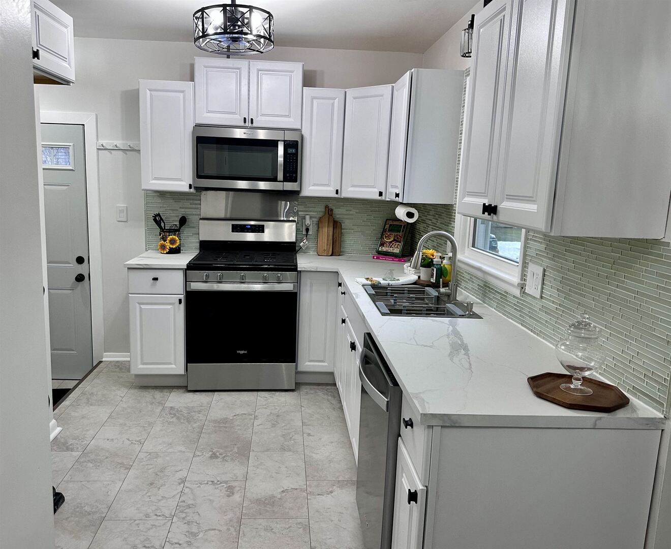 1830 28th Street Rock Island, IL 61201 - Photo 7 of 23 a kitchen with a stove and a refrigerator
