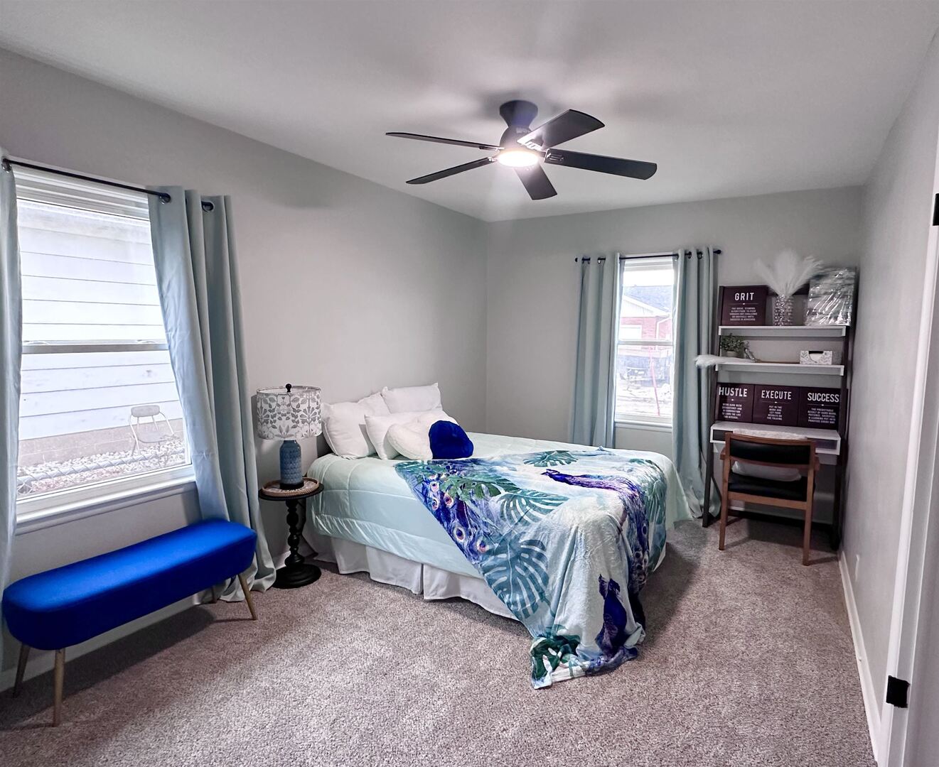 1830 28th Street Rock Island, IL 61201 - Photo 9 of 23 a bedroom with a bed and a chandelier