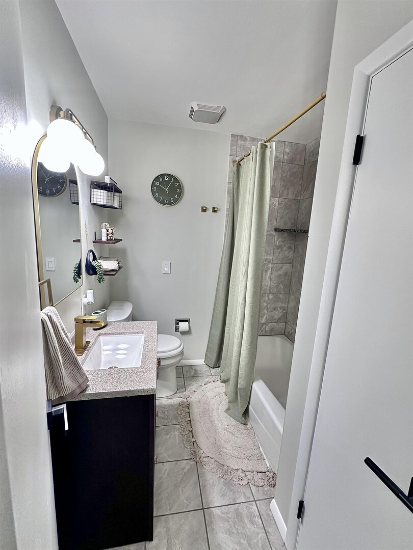 1830 28th Street Rock Island, IL 61201 - Photo 10 of 23 a bathroom with a sink toilet and shower