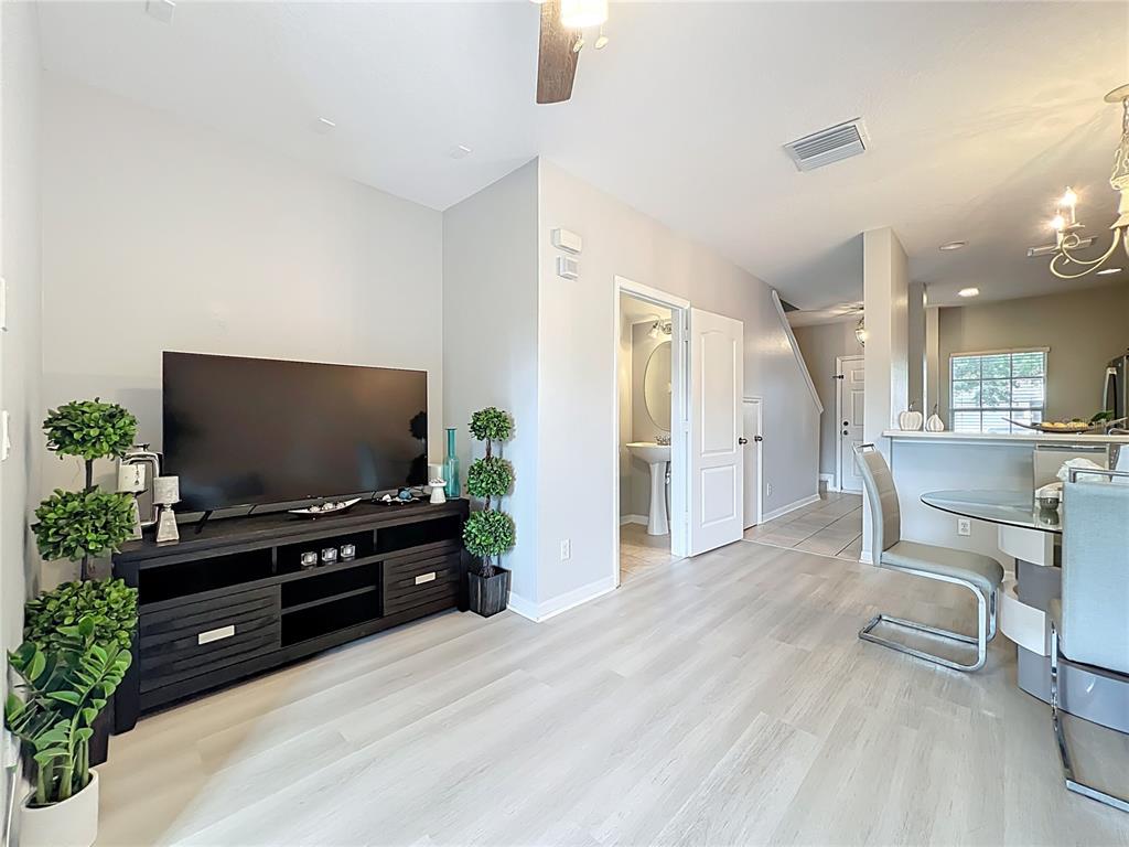 3309 Wilshire Way Road, Unit 3 Orlando, FL 32829 - Photo 13 of 43 a living room with furniture and a flat screen tv