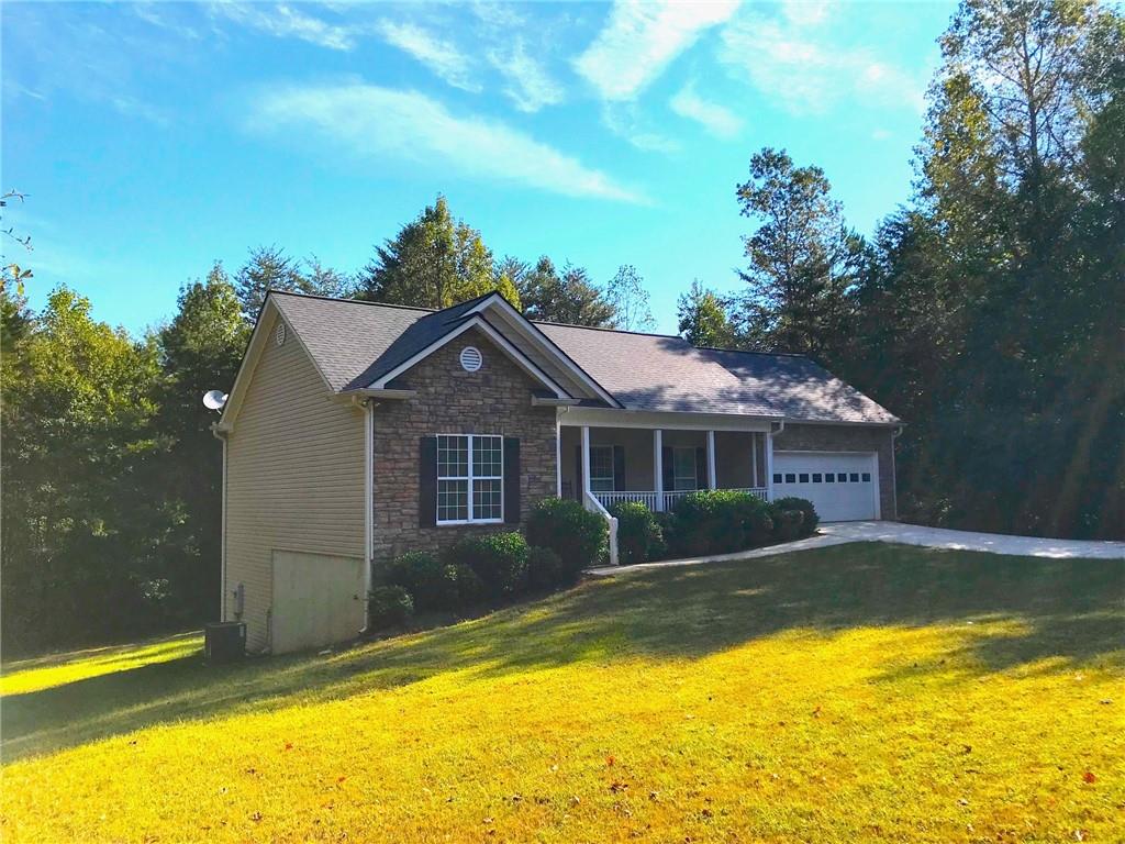 727 McCoy Bridge Road Homer, GA 30547 - Photo 1 of 1 a view of a house with swimming pool