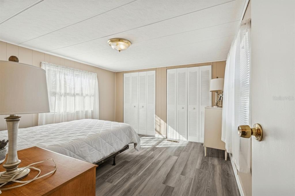 86 Pindo Palm Street West Largo, FL 33770 - Photo 16 of 45 a bedroom with a bed and a window