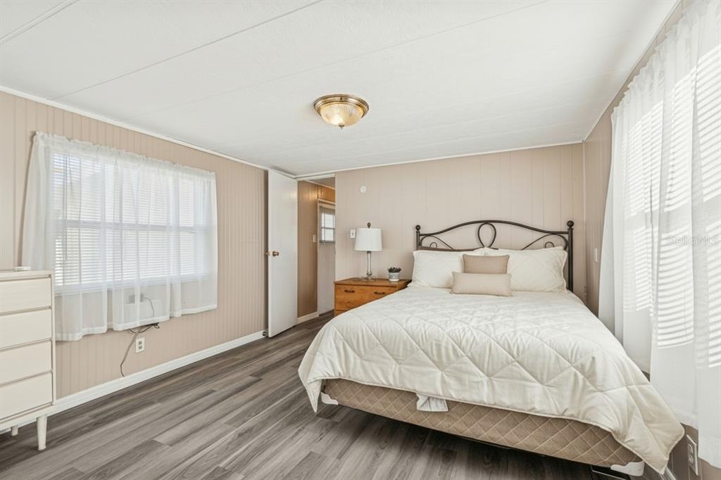 86 Pindo Palm Street West Largo, FL 33770 - Photo 17 of 45 a bedroom with a bed and a window