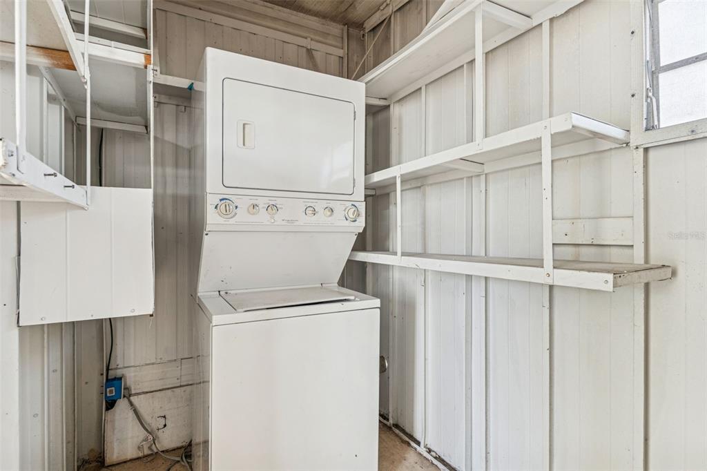 86 Pindo Palm Street West Largo, FL 33770 - Photo 18 of 45 a utility room with dryer and washer