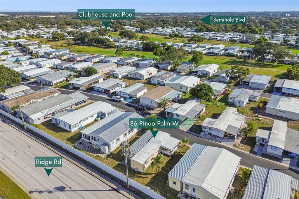 86 Pindo Palm Street West Largo, FL 33770 - Photo 43 of 45 an aerial view of residential houses with outdoor space