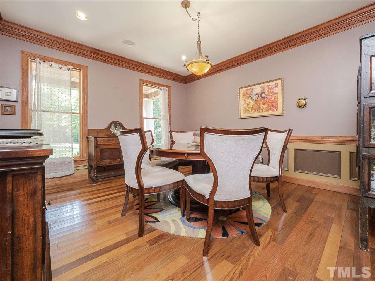 552 Tom Wright Road, Unit LO4 Franklinton, NC 27525 - Photo 11 of 30 a dining room with furniture a chandelier and wooden floor