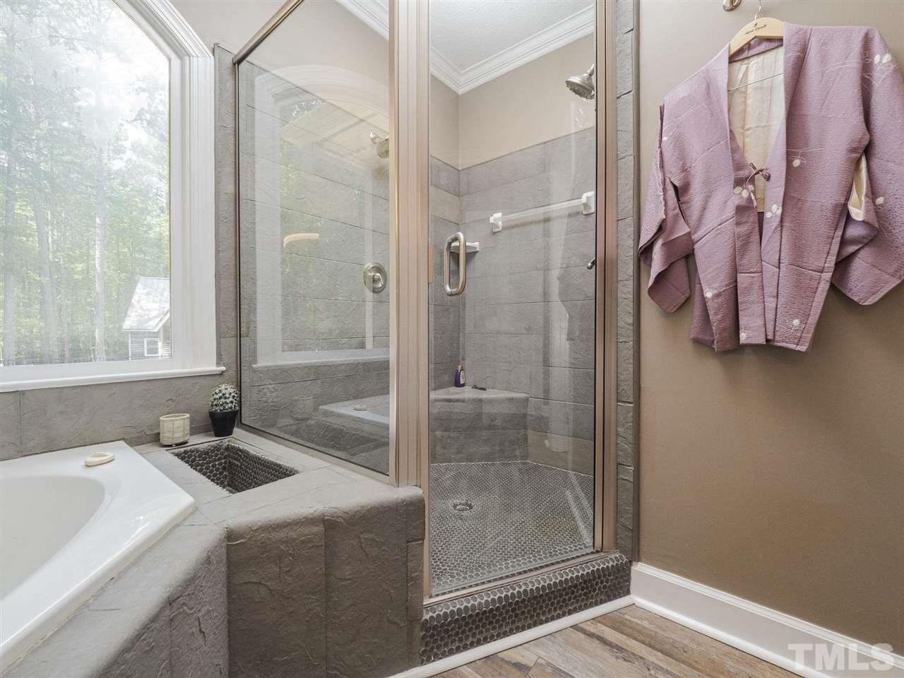 552 Tom Wright Road, Unit LO4 Franklinton, NC 27525 - Photo 17 of 30 a bathroom with a sink and a shower