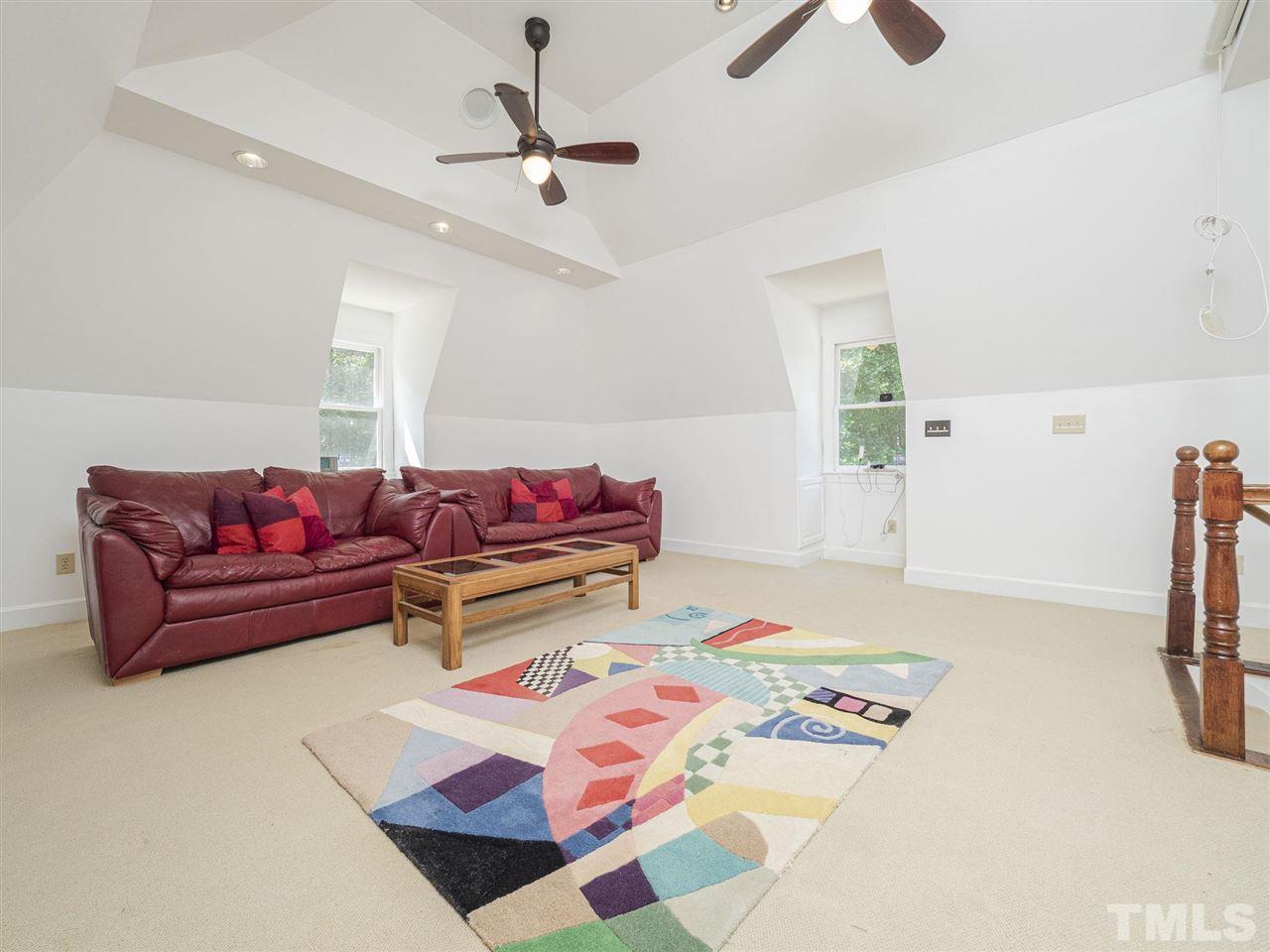 552 Tom Wright Road, Unit LO4 Franklinton, NC 27525 - Photo 23 of 30 a bedroom with furniture and a rug