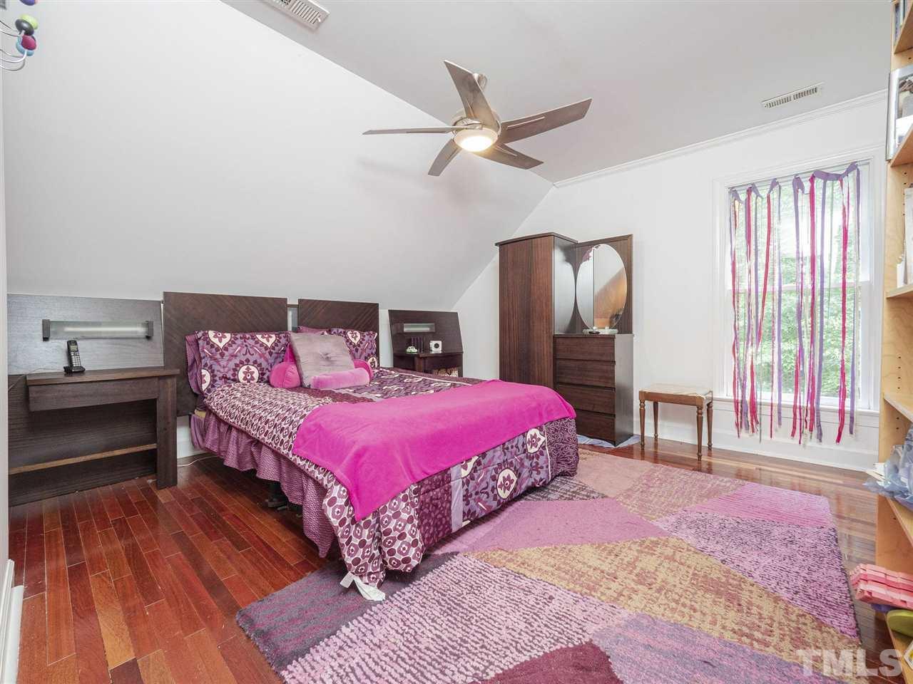 552 Tom Wright Road, Unit LO4 Franklinton, NC 27525 - Photo 26 of 30 a bedroom with a bed dresser and a window