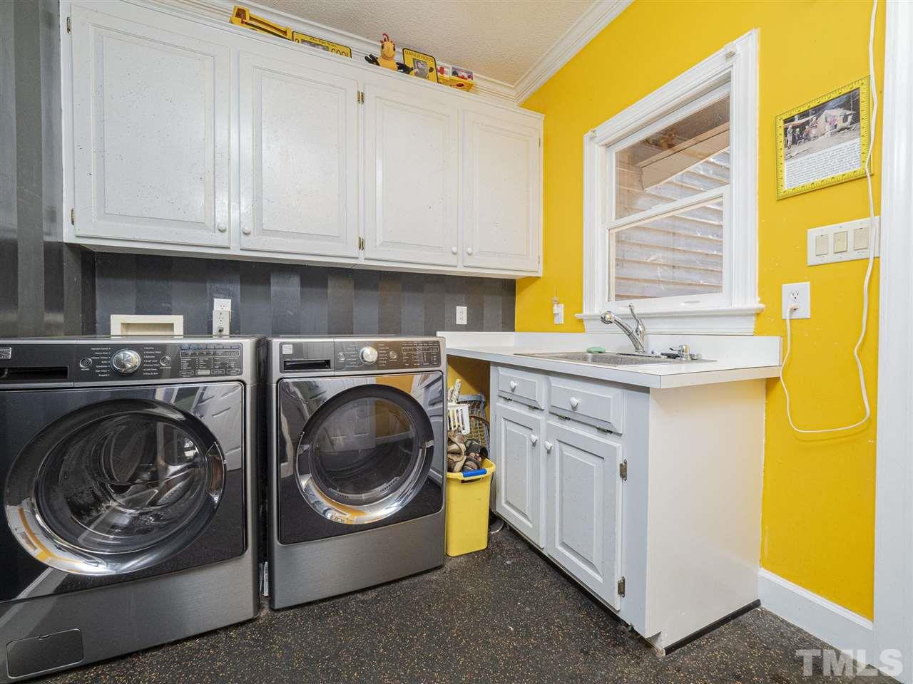 552 Tom Wright Road, Unit LO4 Franklinton, NC 27525 - Photo 29 of 30 a utility room with sink dryer and washer