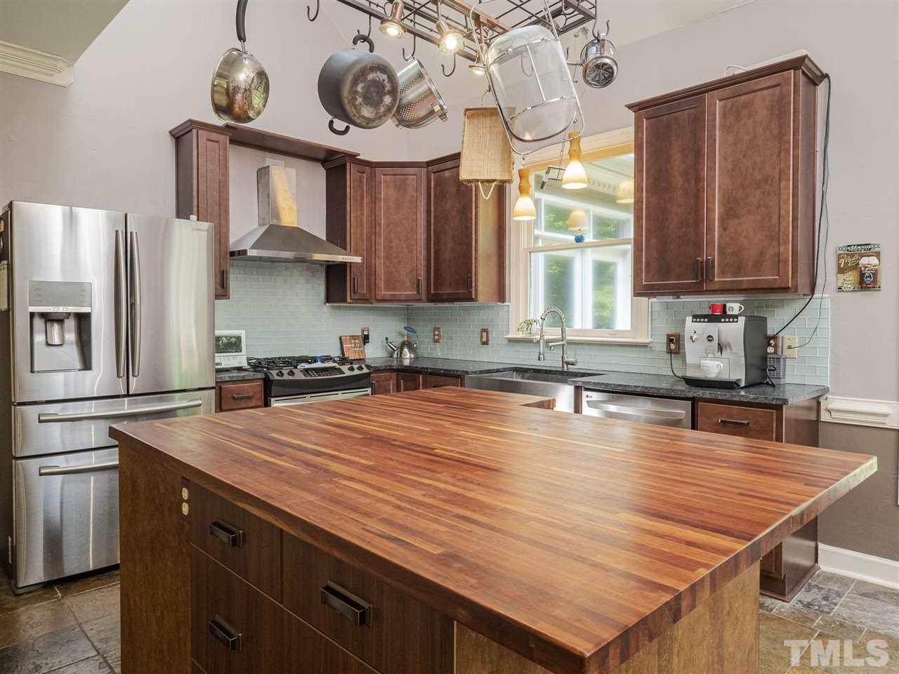 552 Tom Wright Road, Unit LO4 Franklinton, NC 27525 - Photo 8 of 30 a kitchen with stainless steel appliances granite countertop a sink a stove window and cabinets