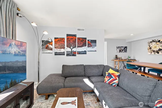 a living room with furniture and rug