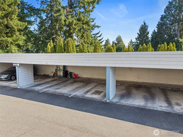 a front view of a building with a garden