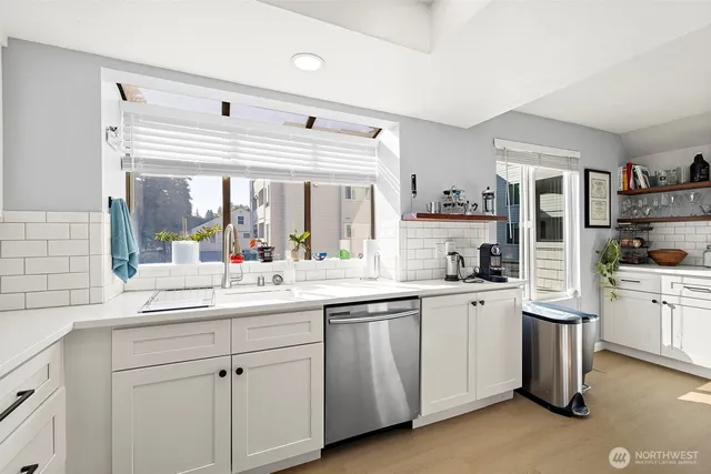 a kitchen with sink and cabinets