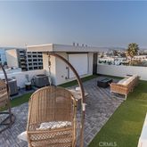 a living room with chairs and a table