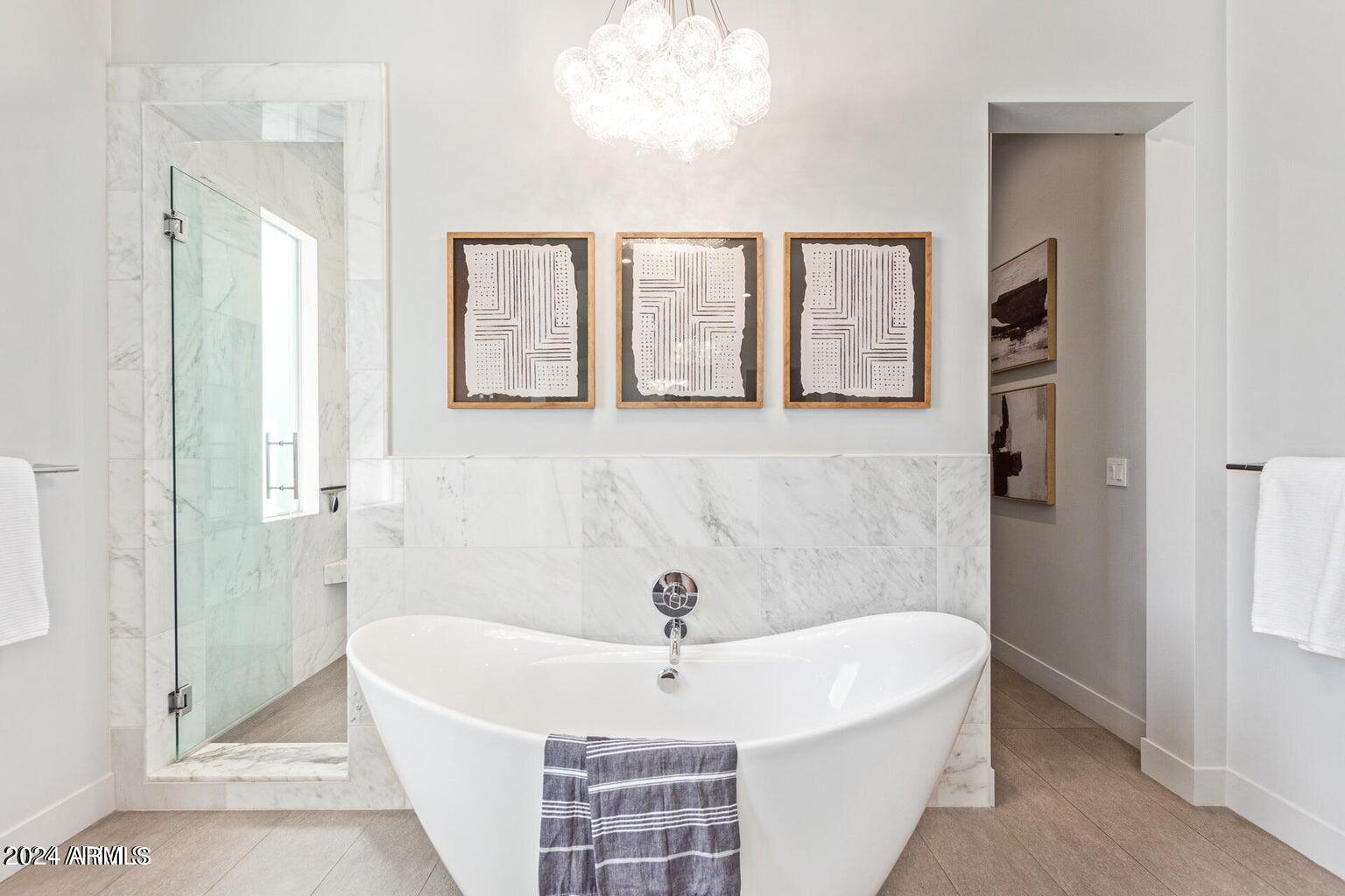 5833 North 46th Street Phoenix, AZ 85018 - Photo 17 of 29 a bathroom with a bathtub and shower