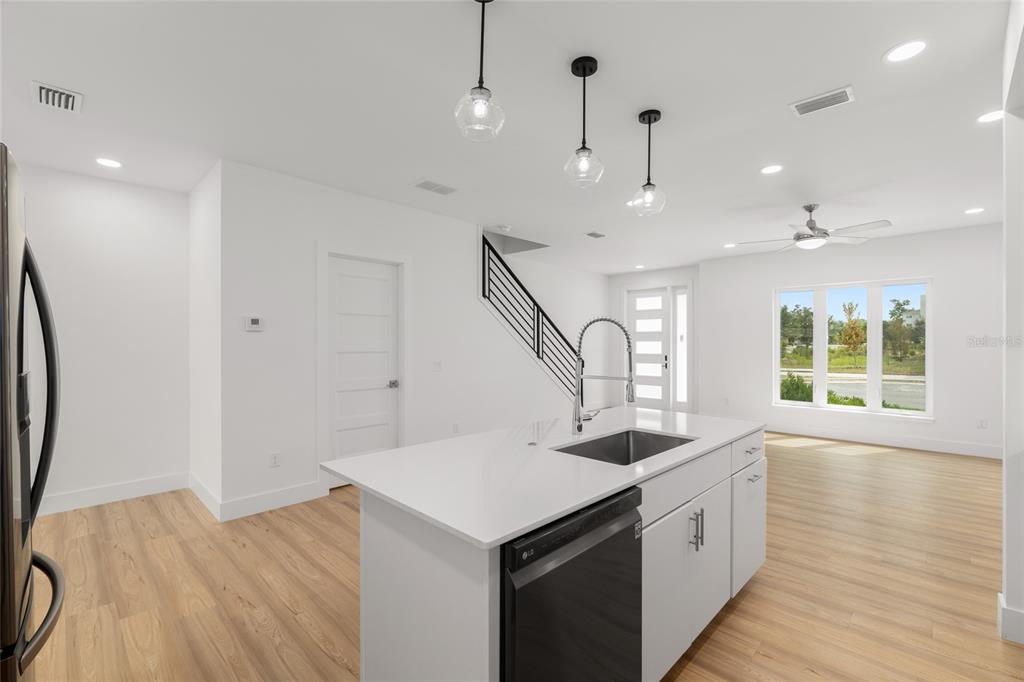 3288 Southwest 49th Terrace Gainesville, FL 32608 - Photo 17 of 71 a kitchen with sink and refrigerator