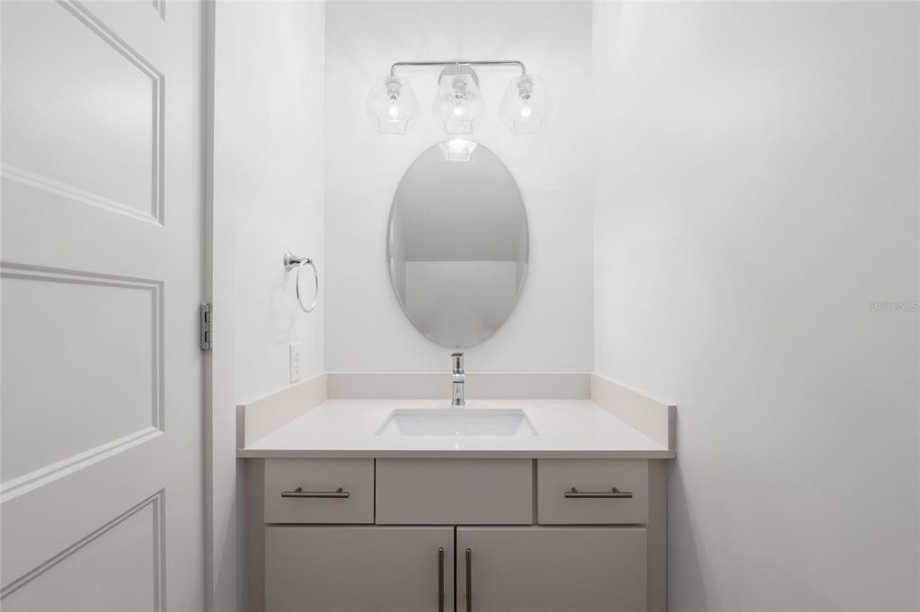 3288 Southwest 49th Terrace Gainesville, FL 32608 - Photo 28 of 71 a sink with a mirror