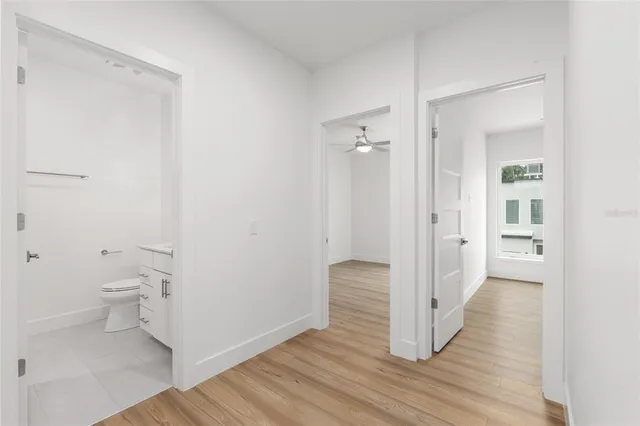a bathroom with a shower sink and mirror