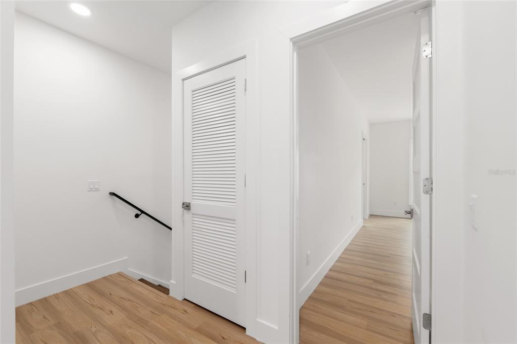 3288 Southwest 49th Terrace Gainesville, FL 32608 - Photo 32 of 71 a view of a hallway with wooden floor