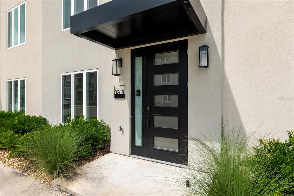 3288 Southwest 49th Terrace Gainesville, FL 32608 - Photo 4 of 71 a front view of a house with a yard