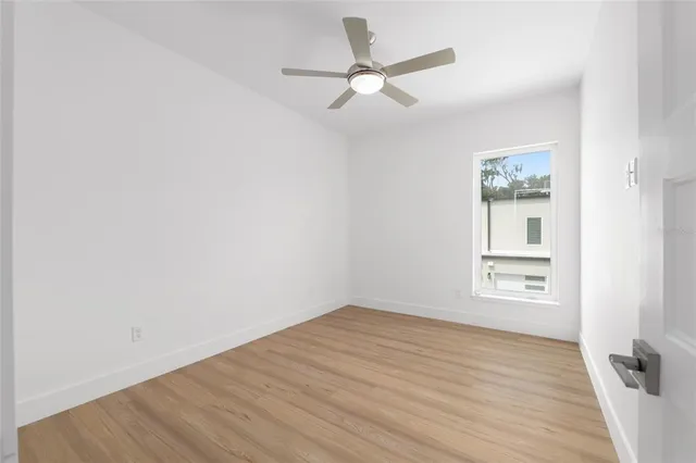 a view of a swimming pool with a terrace seating area and garden