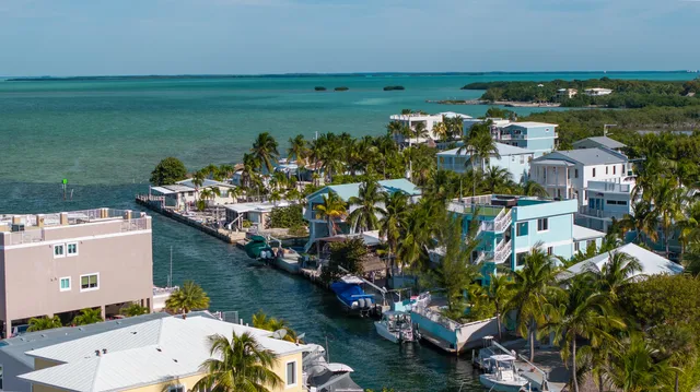 a view of a chairs and table on the deck