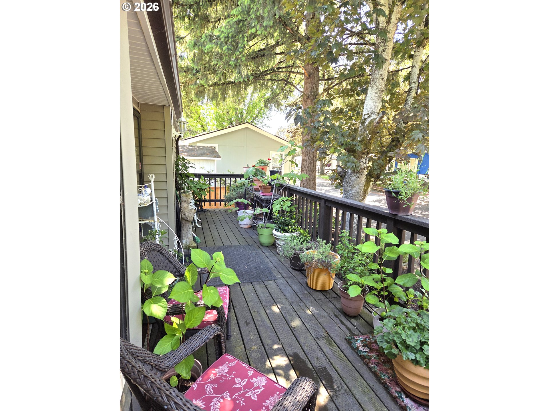 1475 Green Acres Road, Unit 83 Eugene, OR 97408 - Photo 33 of 37 a view of a balcony with wooden floor