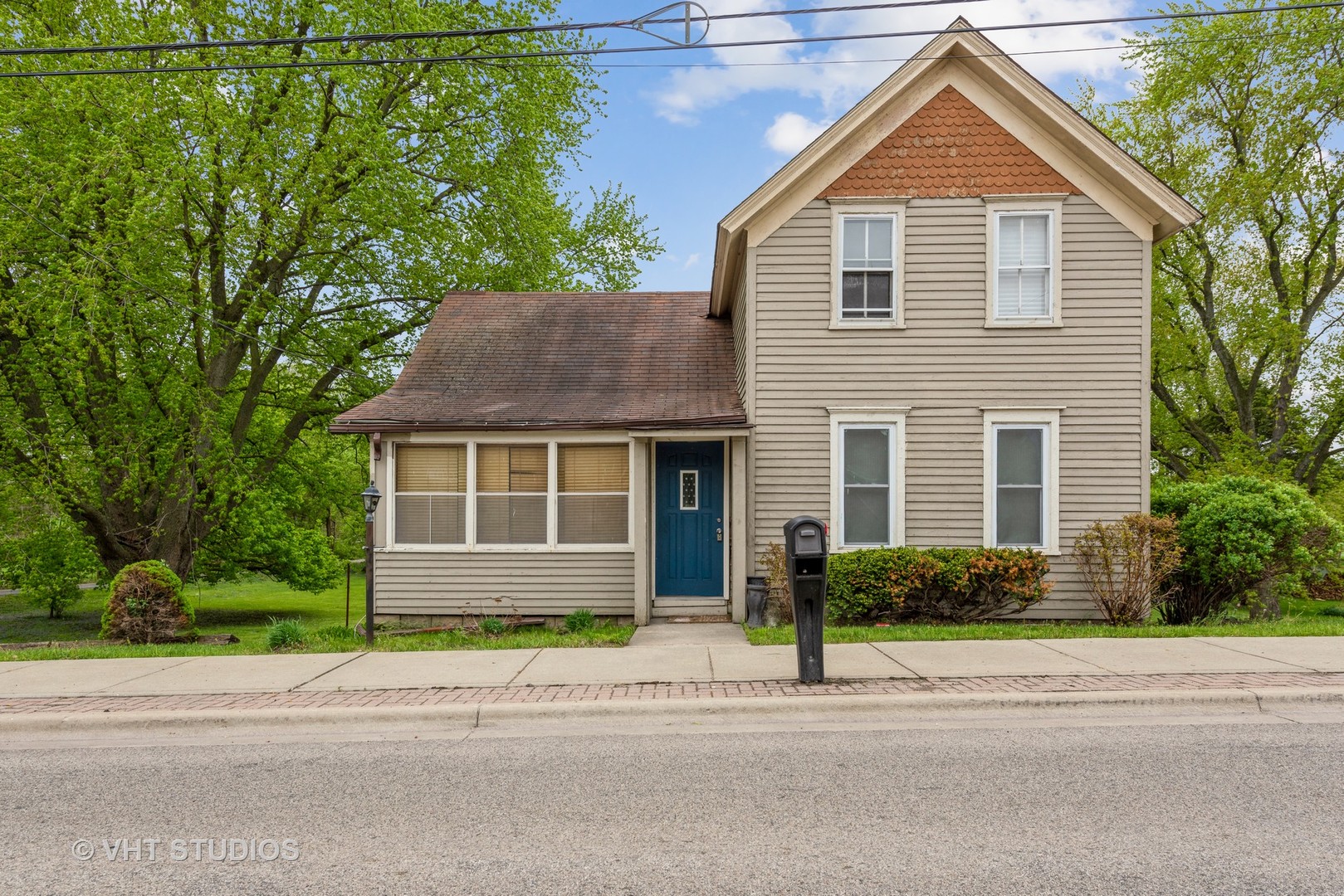 2517 Johnsburg Road Johnsburg, IL 60051 - Photo 1 of 11 a front view of a house with a yard and garage
