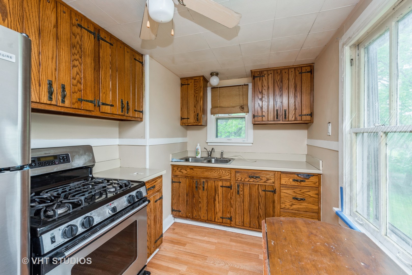 2517 Johnsburg Road Johnsburg, IL 60051 - Photo 3 of 11 a kitchen with stainless steel appliances granite countertop a stove and a sink