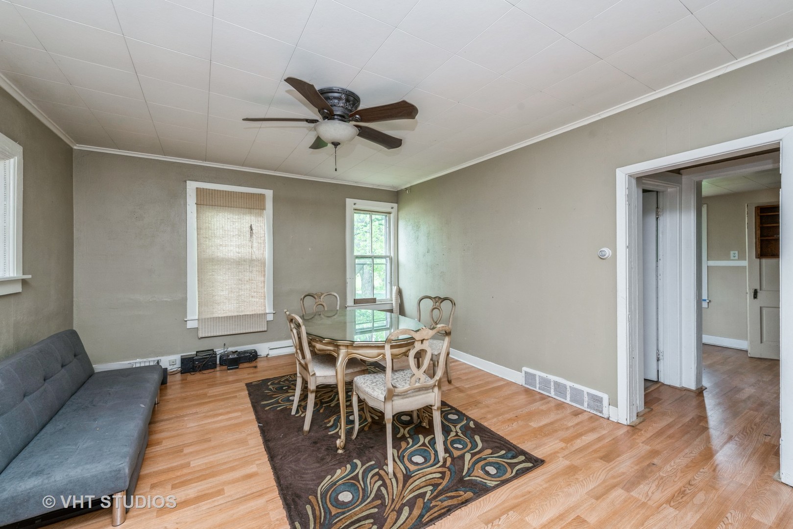 2517 Johnsburg Road Johnsburg, IL 60051 - Photo 4 of 11 a view of a dining room with furniture window and wooden floor