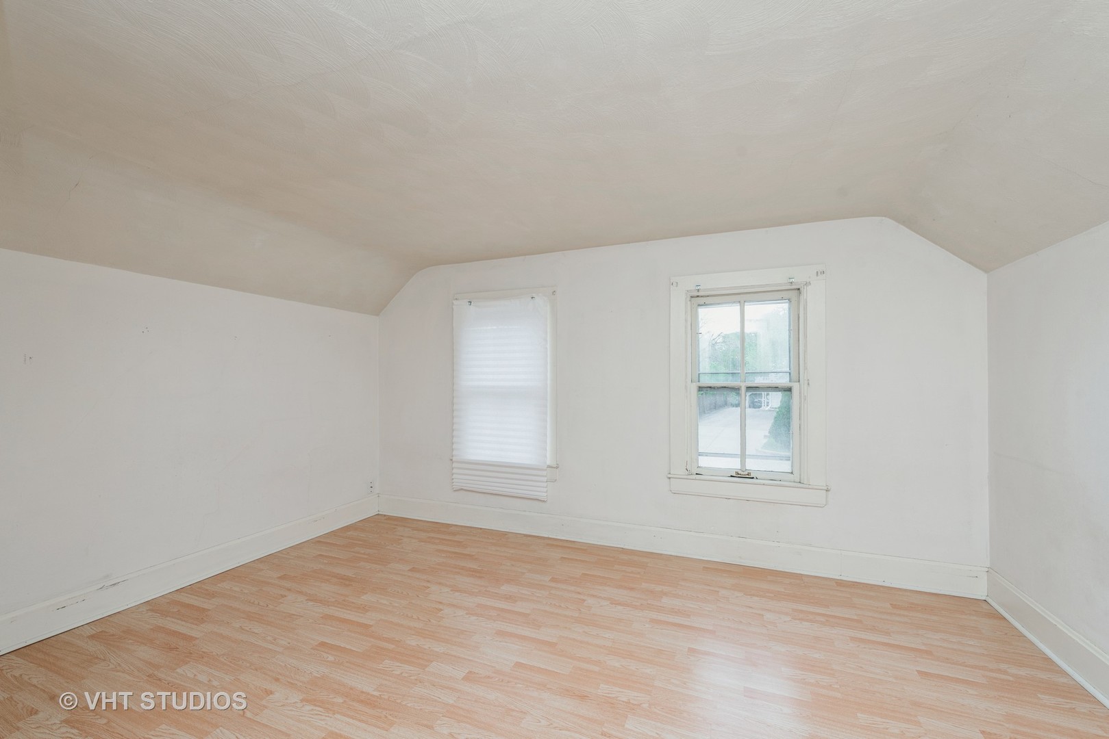 2517 Johnsburg Road Johnsburg, IL 60051 - Photo 6 of 11 an empty room with wooden floor and windows