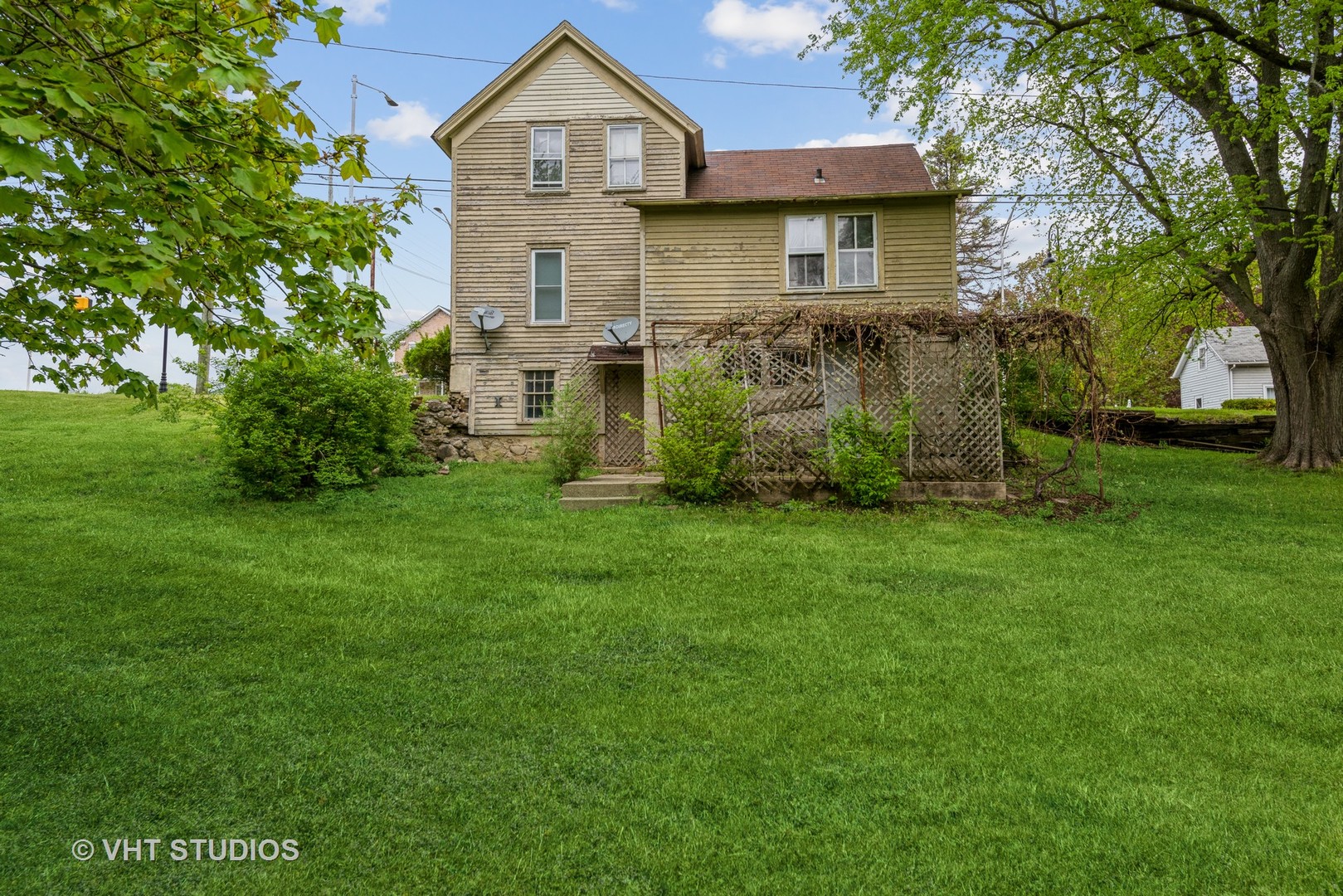 2517 Johnsburg Road Johnsburg, IL 60051 - Photo 8 of 11 a front view of a house with a garden