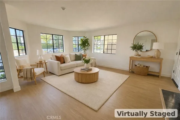 a living room with furniture and fireplace