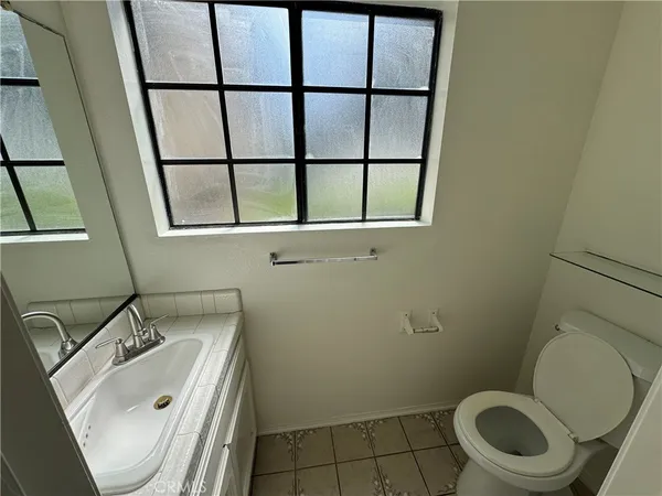 a bathroom with a sink and a toilet