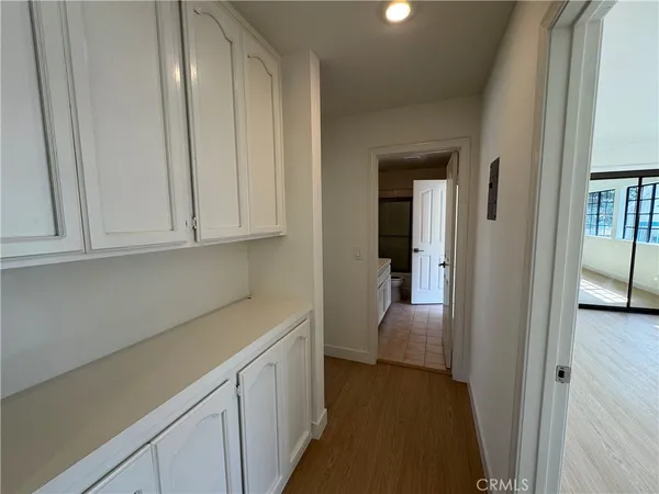a view of a kitchen from the hallway