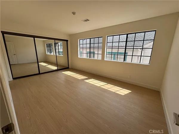 a view of an empty room with a window