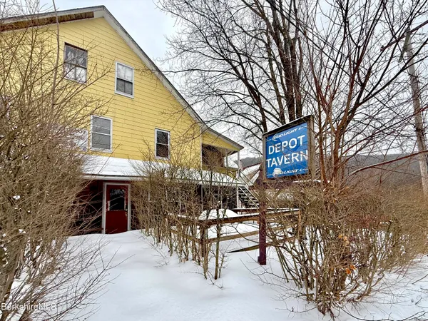 a kitchen with stainless steel appliances a refrigerator and a stove top oven