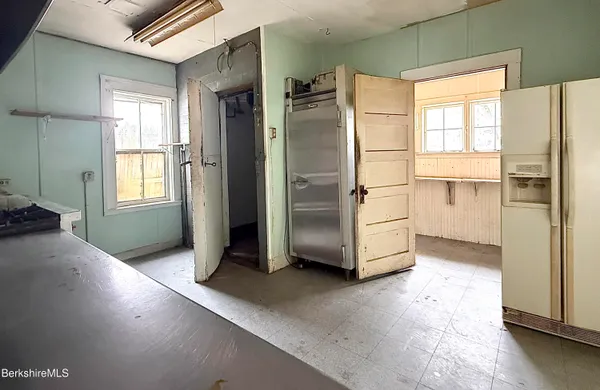 a bathroom with a sink a mirror and a window