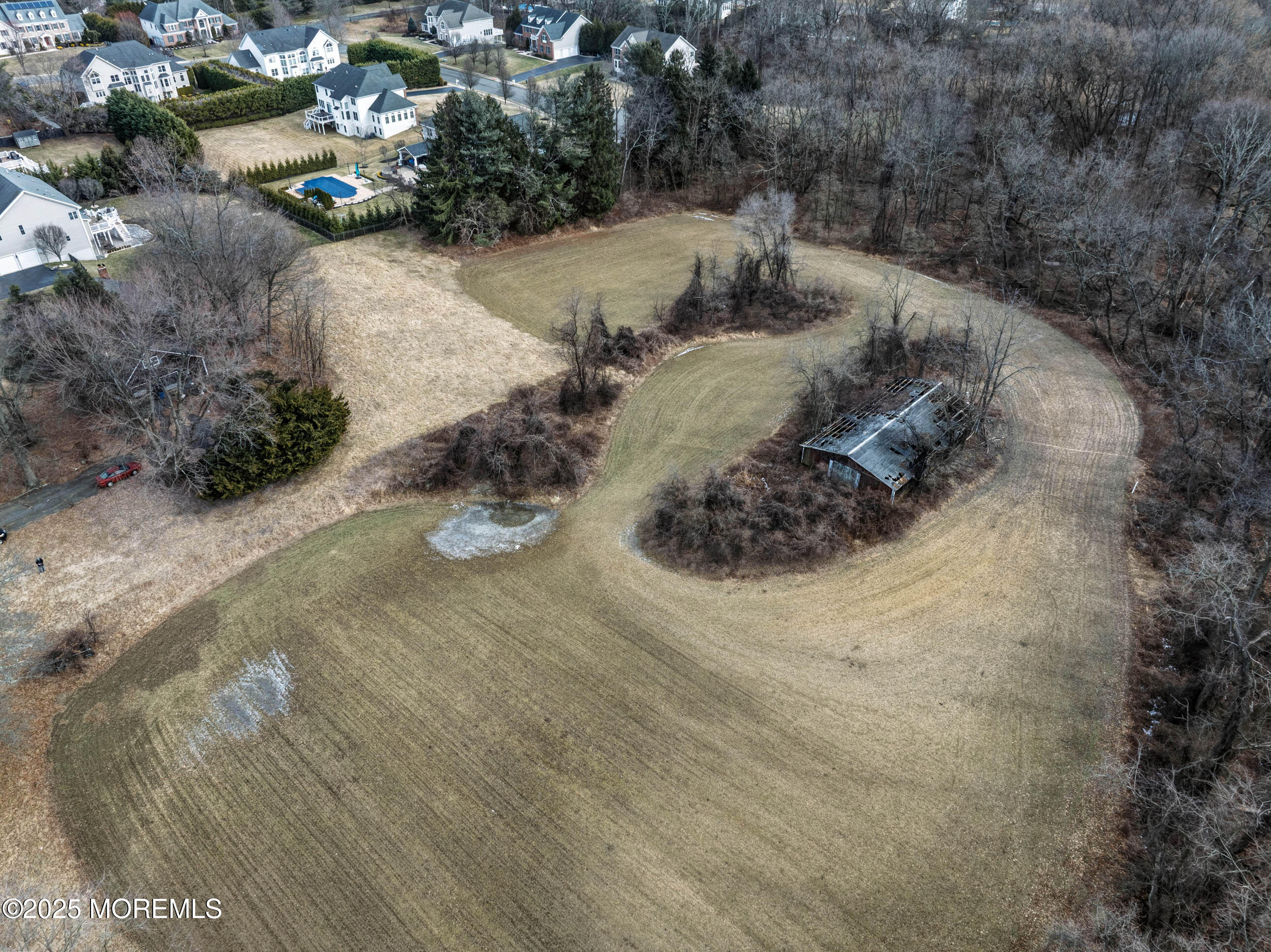 16 Pleasant Valley Road Morganville, NJ 07751 - Photo 12 of 18 a view of a backyard of water