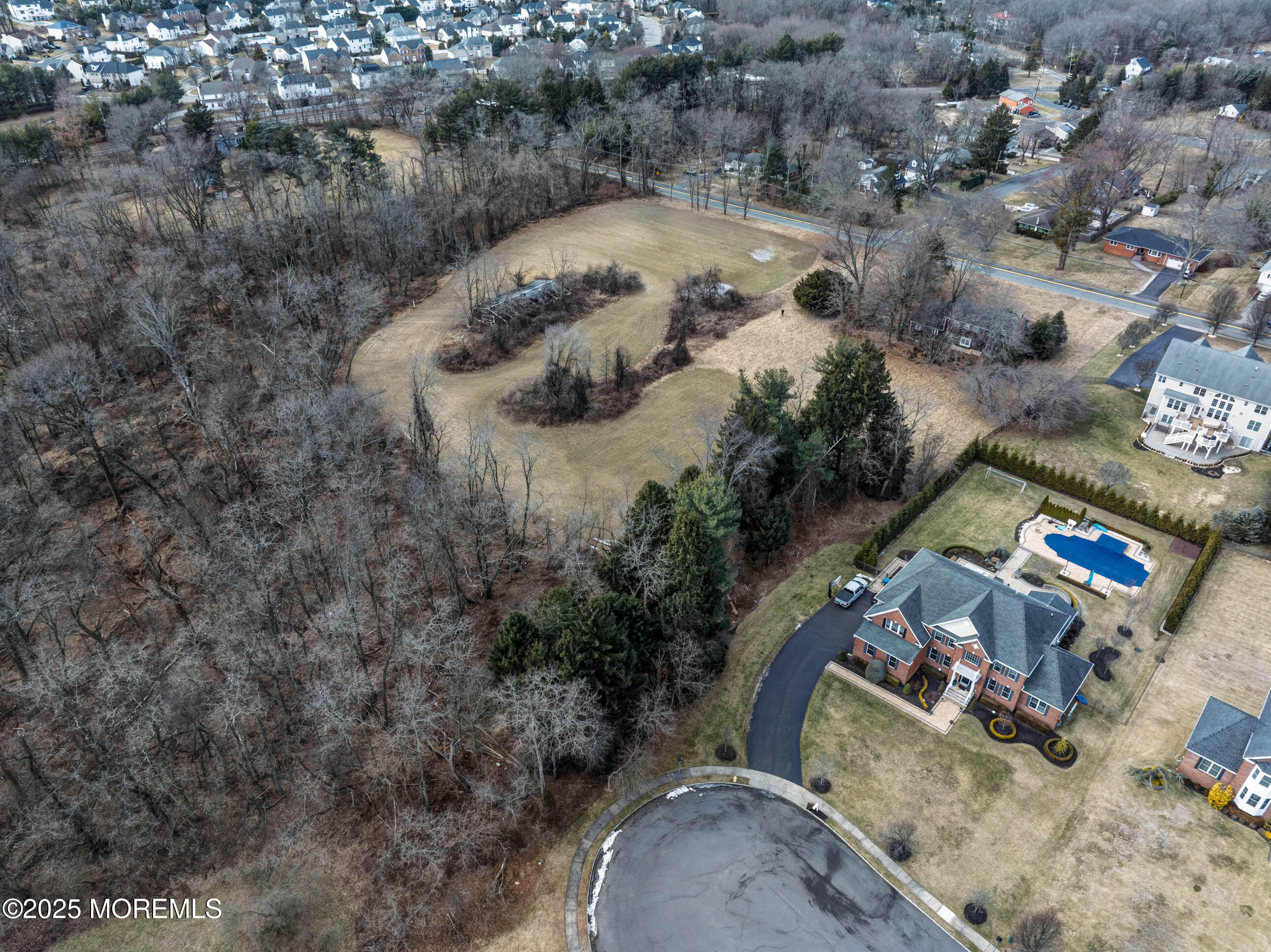 16 Pleasant Valley Road Morganville, NJ 07751 - Photo 14 of 18 an aerial view of a house with a yard and lake view