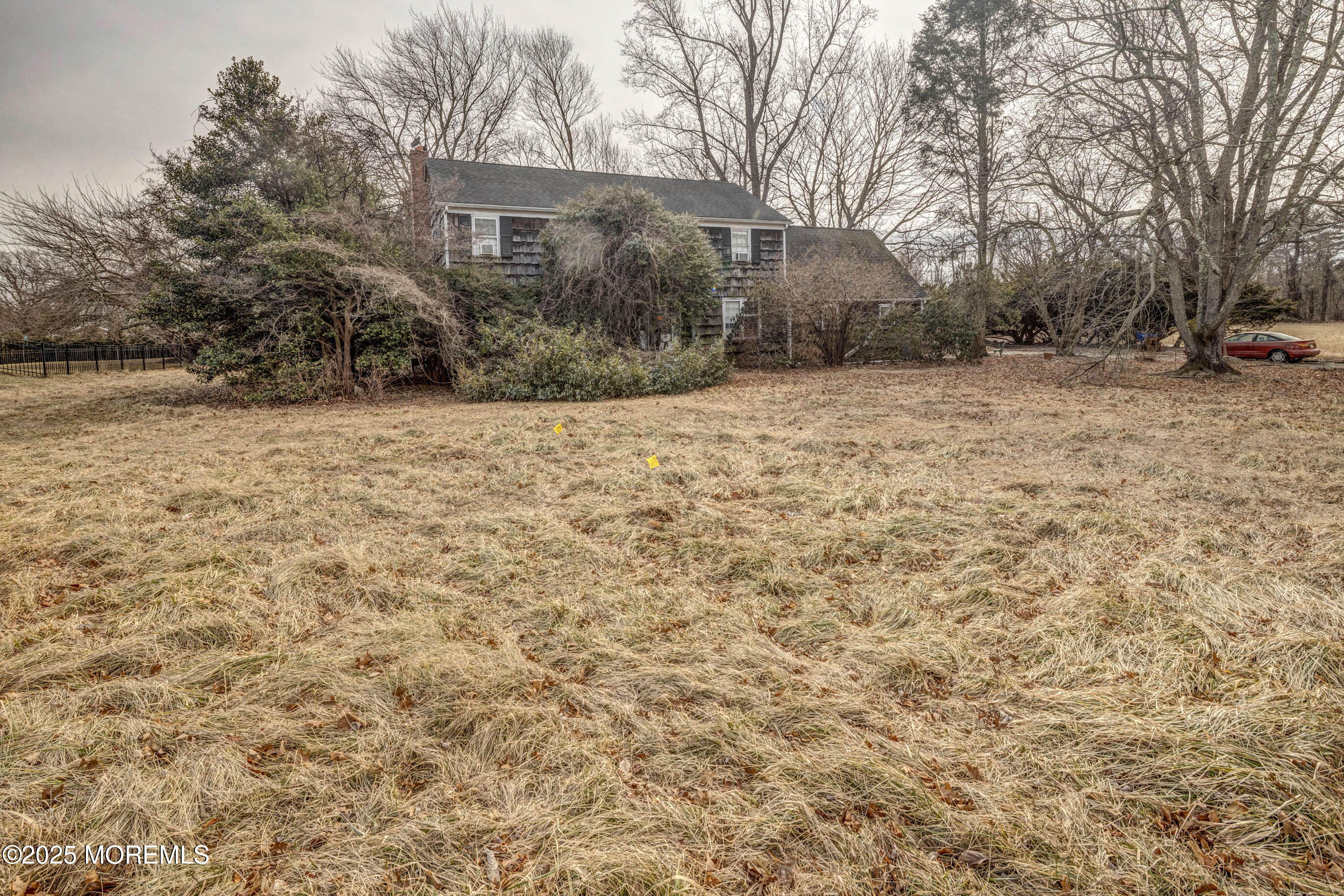 16 Pleasant Valley Road Morganville, NJ 07751 - Photo 4 of 18 a view of a yard with trees