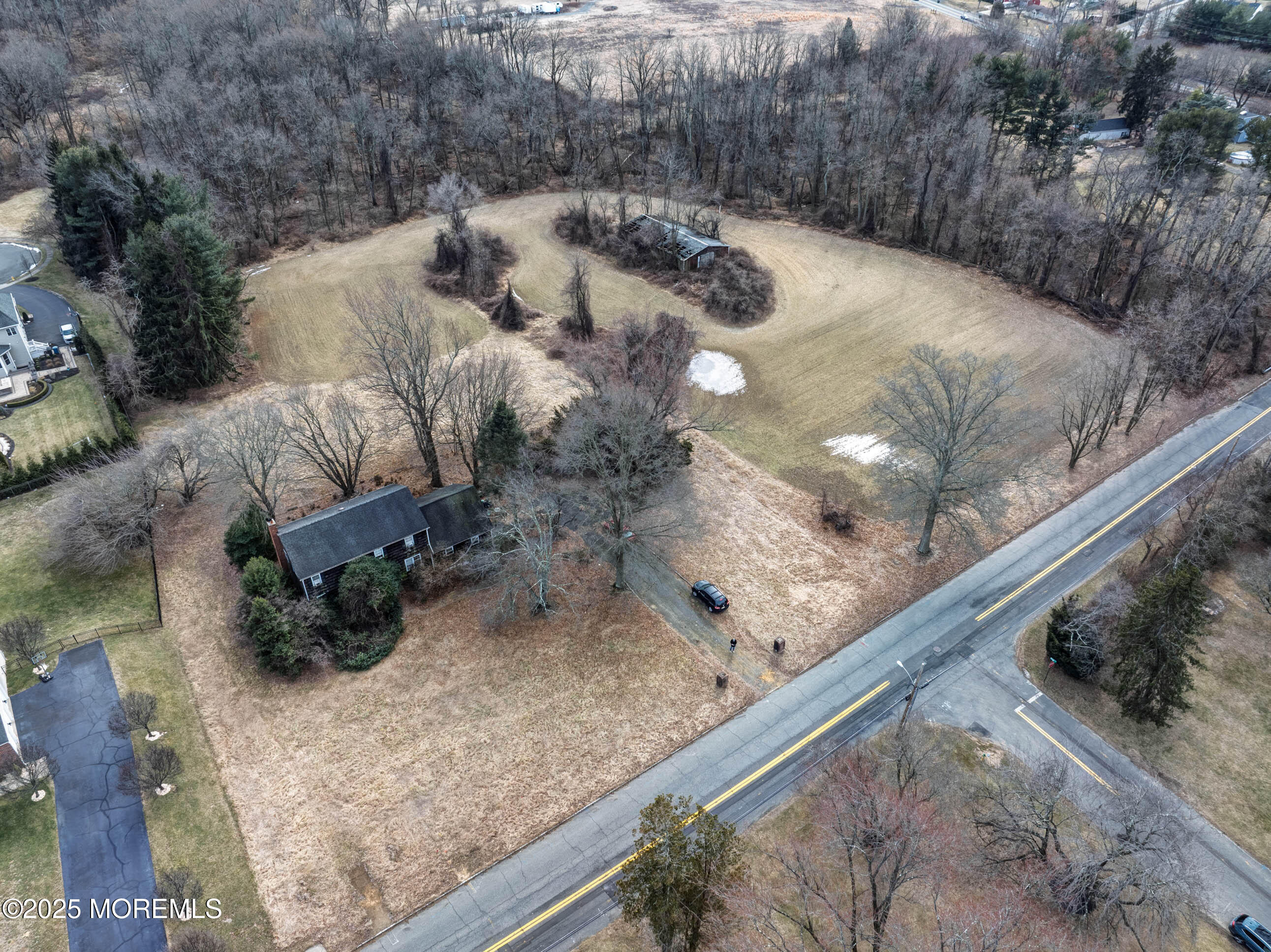 16 Pleasant Valley Road Morganville, NJ 07751 - Photo 9 of 18 a view of a backyard of a house